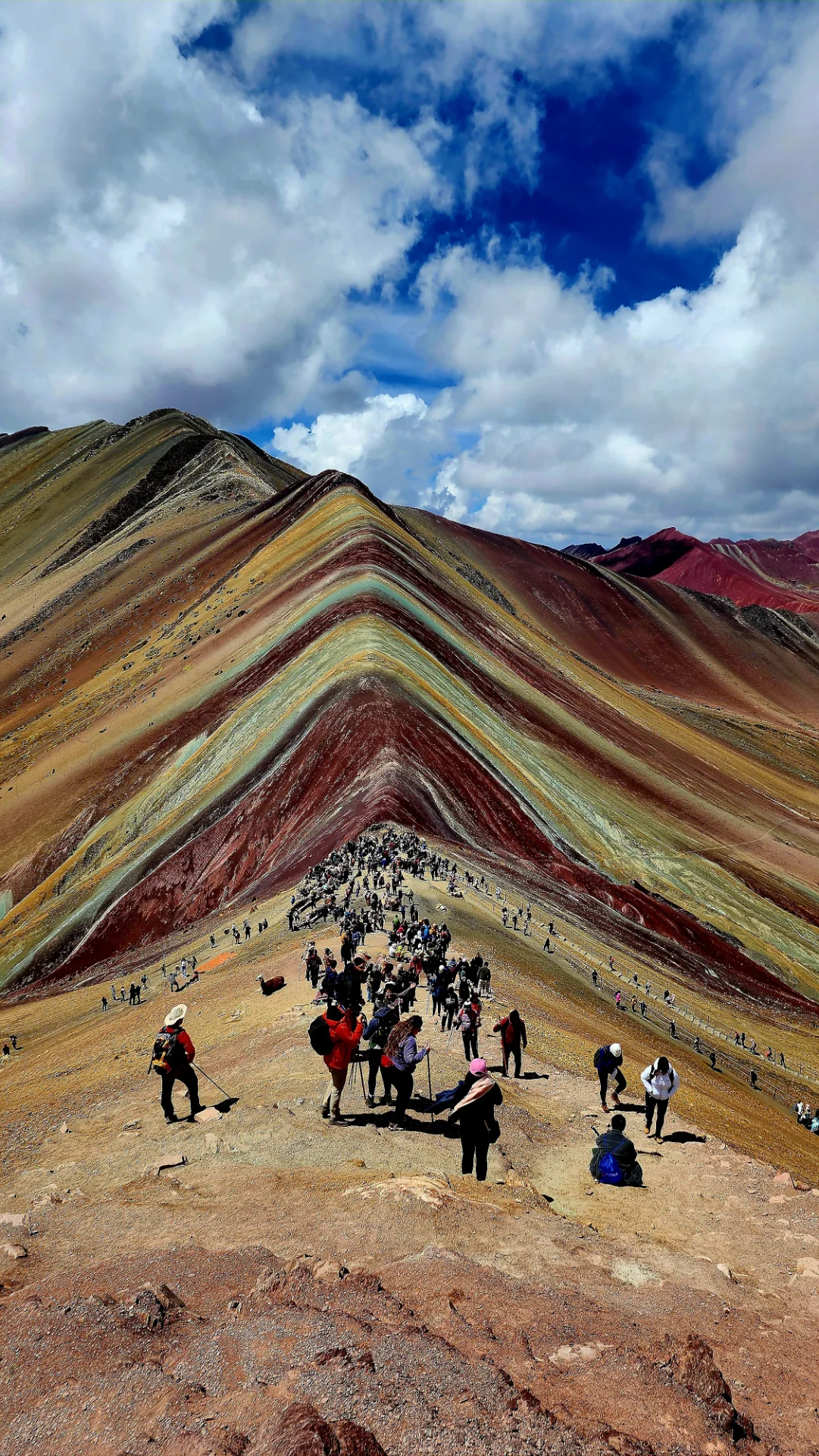 Full view of Vinicunca Rainbow Mountain and the surrounding Peruvian Andes